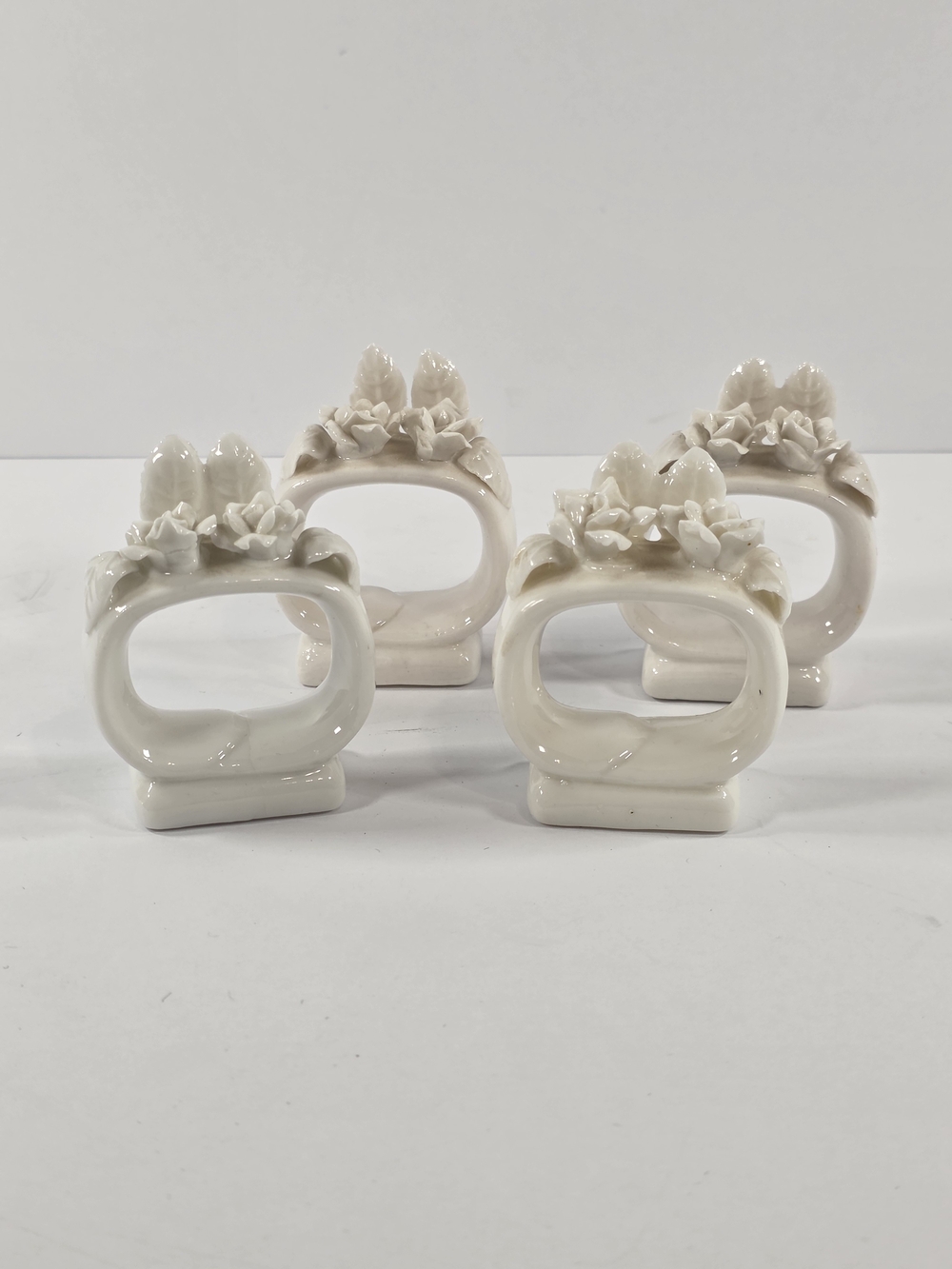 Set of 4 Vintage White Porcelain Napkin Rings with Raised Flowers And Leaves